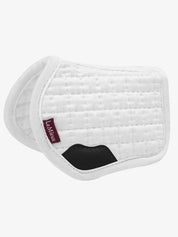 Side view of the white LeMieux Toy Pony Saddle Pad on a white background