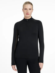 Front view of a model wearing the black LeMieux Halle Lightweight Base Layer on a white background