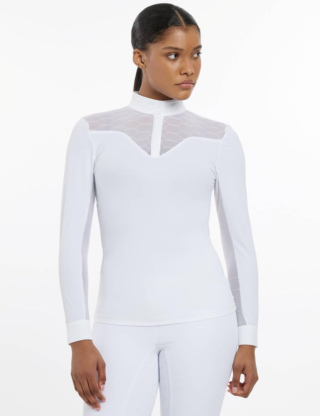 Front view of a female model wearing the white LeMieux Emily Long Sleeve Show Shirt on a plain background