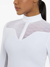 Close-up front view of a female model wearing the white LeMieux Emily Long Sleeve Show Shirt on a plain background
