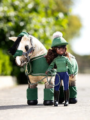 Front view of the green Maya LeMieux Toy Rider standing outside in front of a buckskin toy pony