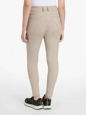 Back view of a model wearing the tan LeMieux Isabelle Knee Grip Breeches on a white background