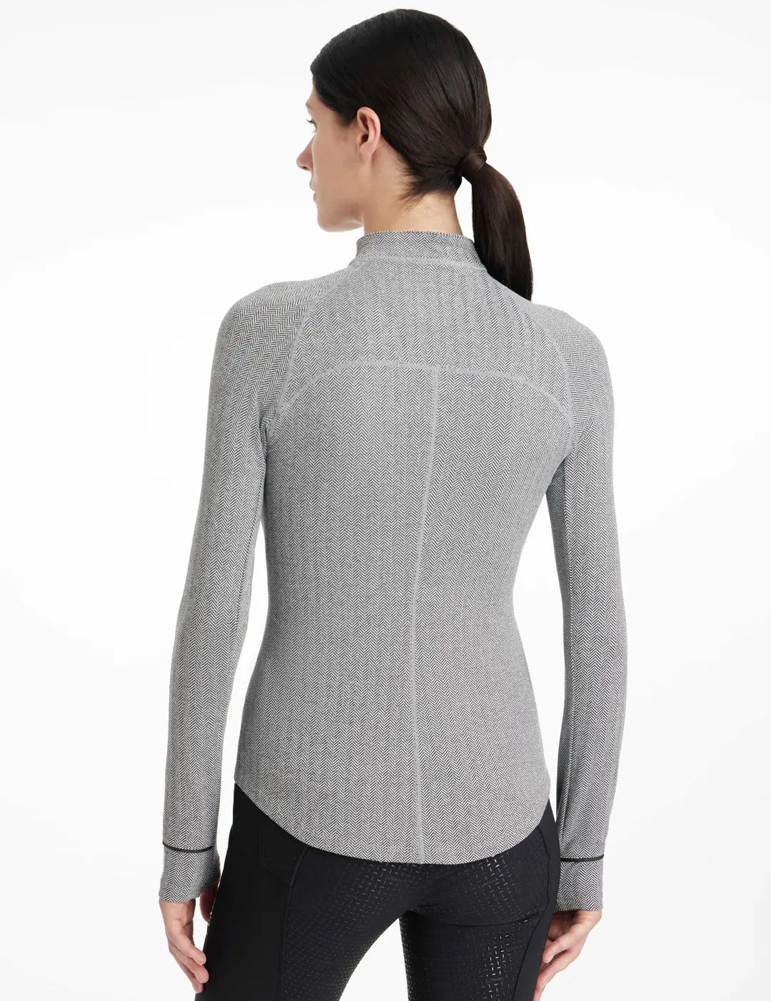 Back view of a model wearing the gray LeMieux Aspen Herringbone Baselayer on a plain background