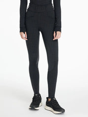 Front view of a model wearing the LeMieux Aspen Houndstooth Gigi Bregging on a plain background