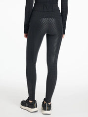 Back view of a model wearing the LeMieux Aspen Houndstooth Gigi Bregging on a plain background
