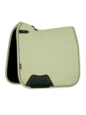 Side view of the macaron LeMieux Suede Dressage Square Pad on a white background