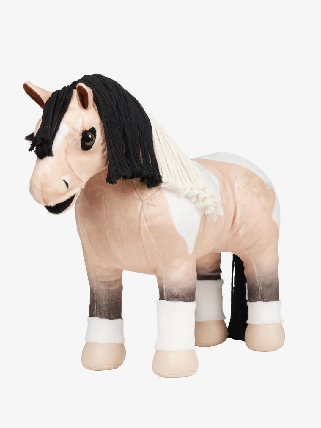 A buckskin paint stuffed animal horse with black and white mane on a white background
