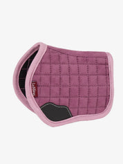 Side view of the pink LeMieux Toy Pony Saddle Pad on a white background
