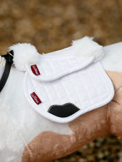Side view of a buckskin paint toy pony wearing the LeMieux Toy Pony Merino Half Pad