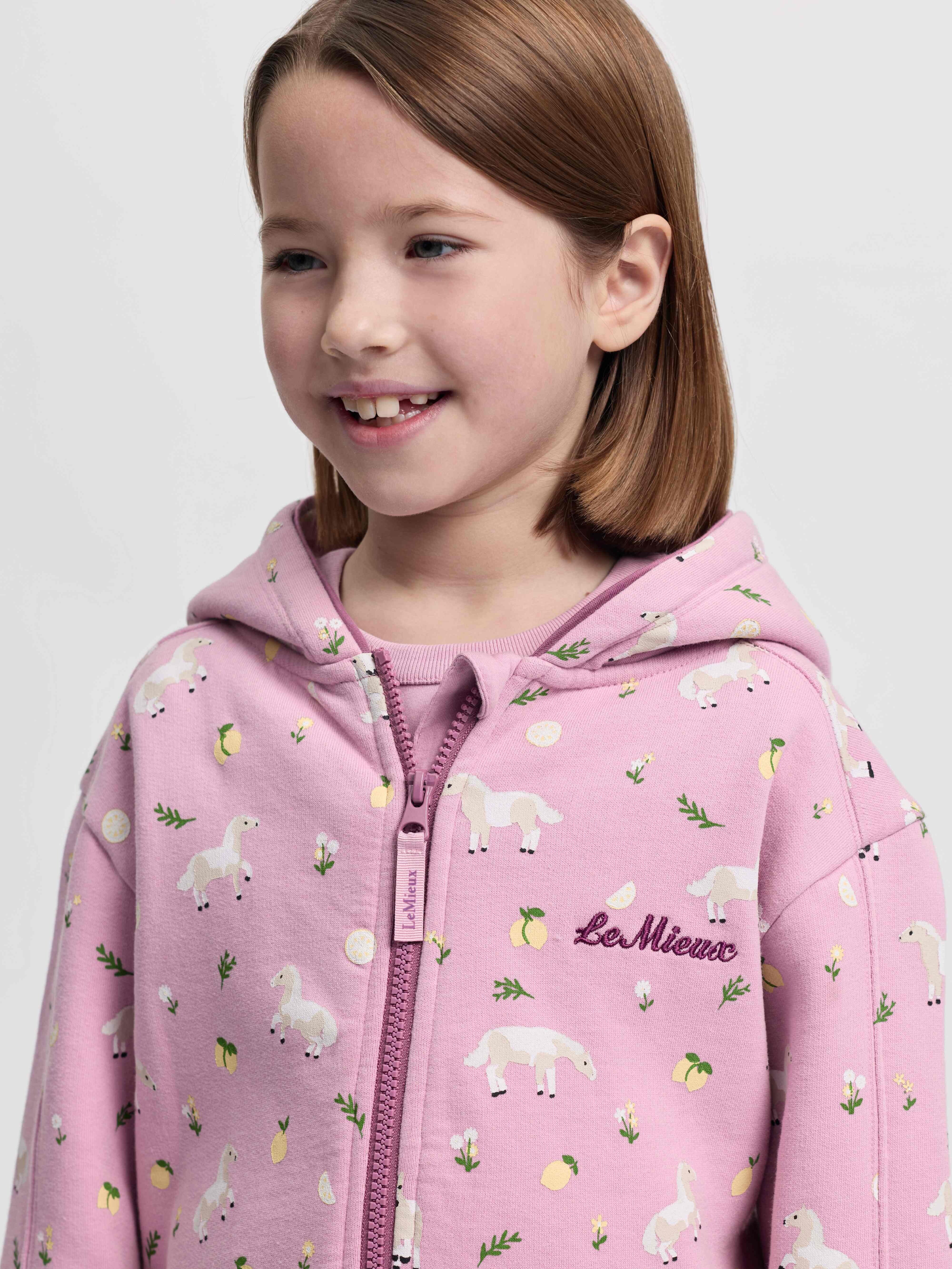 LeMieux Mini Charlie zip through hoodie in Fondant showing front zipper and printed detail