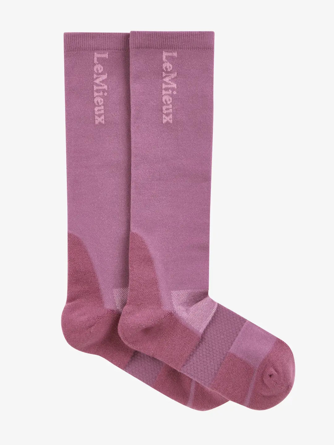 Side view of a pink pair of LeMieux Performance Socks on a white background