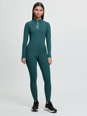 Full body front view of a young female model wearing the jungle Lemieux Young Rider Orla Pull On Tight on a plain background