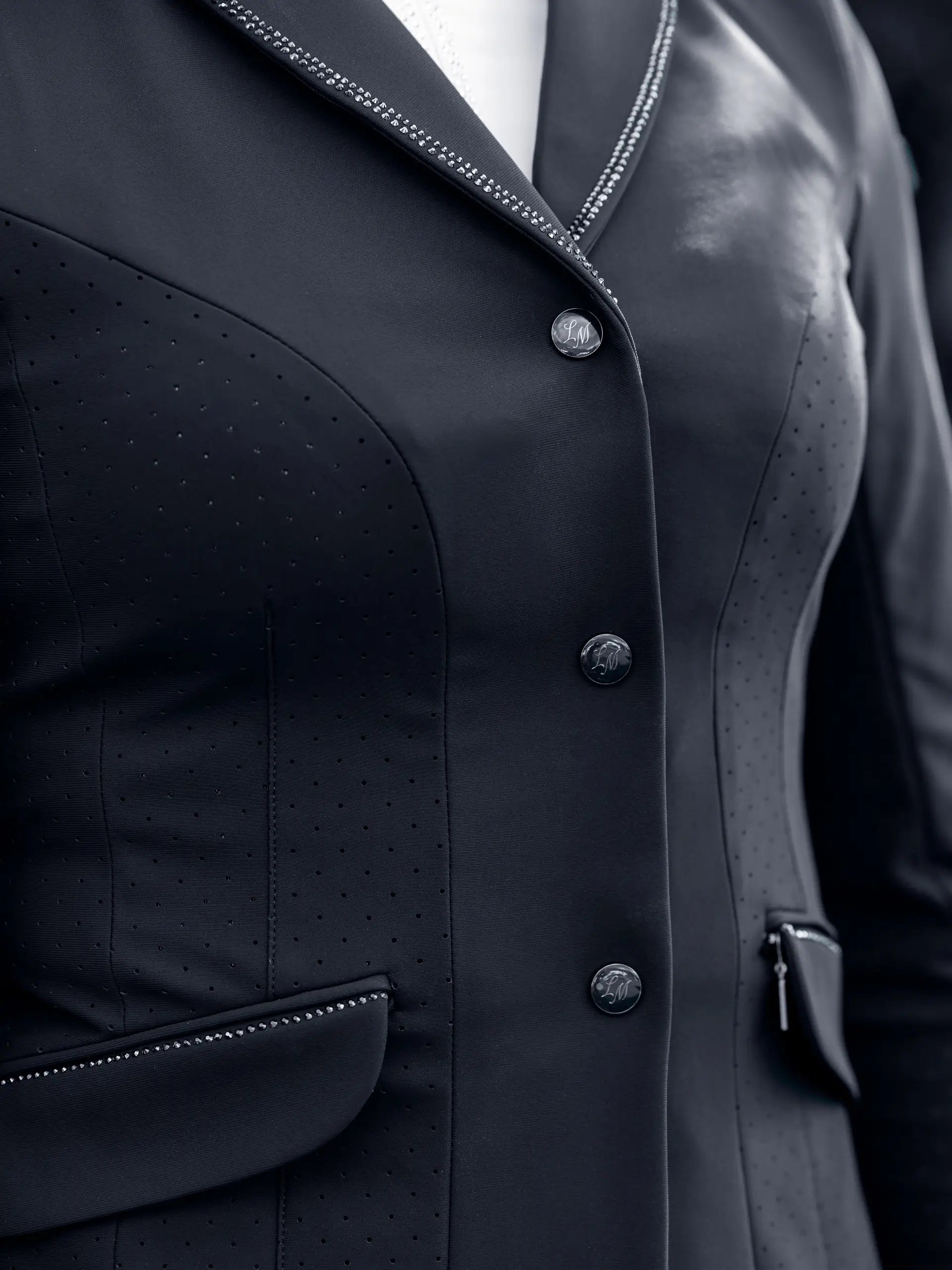 Close-up view of the buttons on the navy LeMieux Brilliance Diana Show Jacket