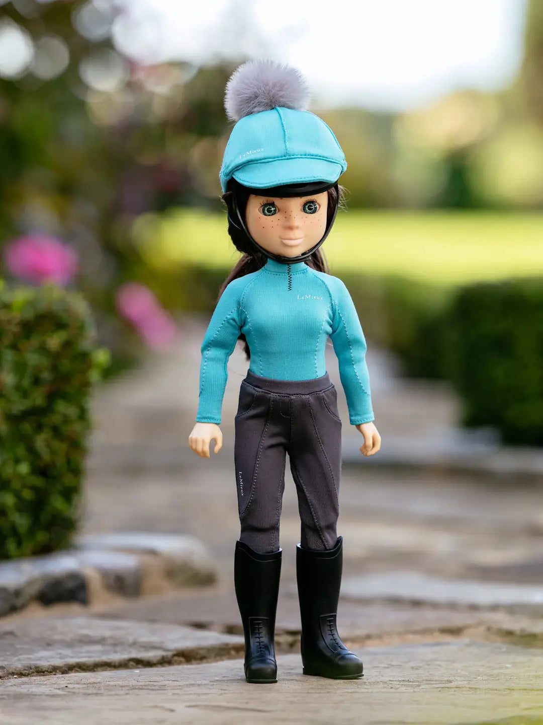 Front view of the blue Florence LeMieux Toy Rider standing outside