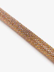 Close-up view of the handle on the espresso LeMieux Brilliance Schooling Whip on a white background