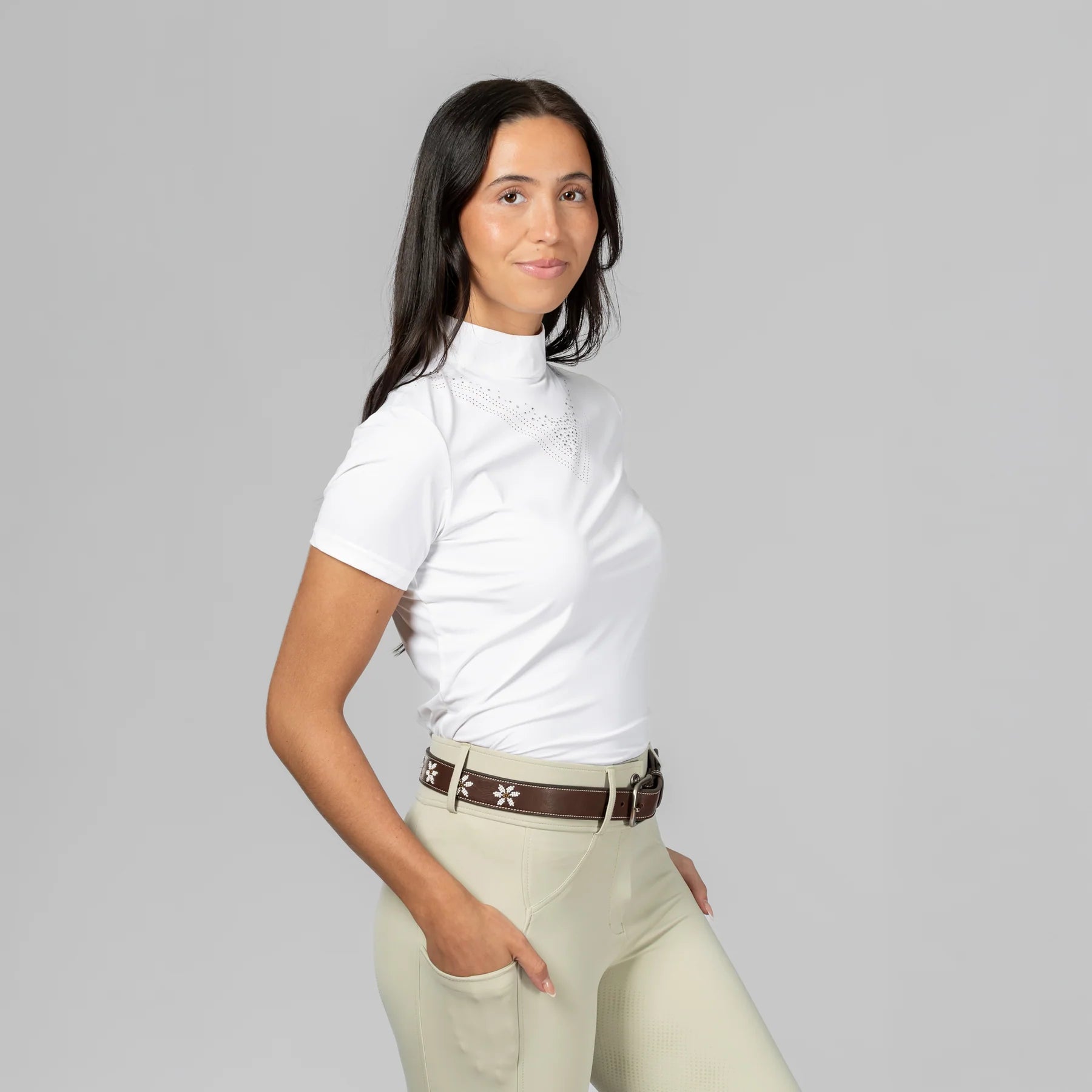 Angled front view of a model wearing Dark Brown/Flowers Equinavia Adeline Beaded Belt on plain background