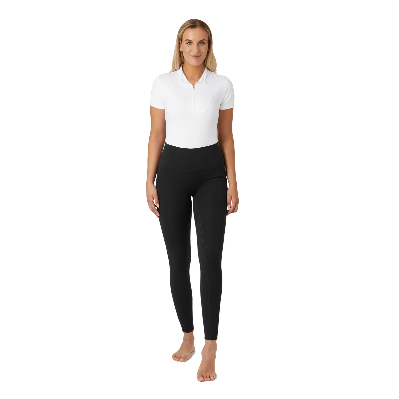 Full body front view of a female model wearing the black Horze Gillian Silicone Full Seat Tights and white shirt on a white background