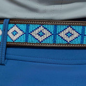 Close-up view of the dark brown leather Equinavia Estelle Hand Beaded Belt with blue and white beading