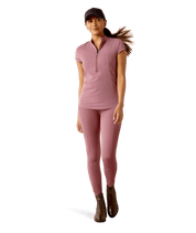 Full body front view of a model wearing the tulipwood Ariat Breathe 1/2 Zip Short Sleeve Baselayer and matching tights on a white background