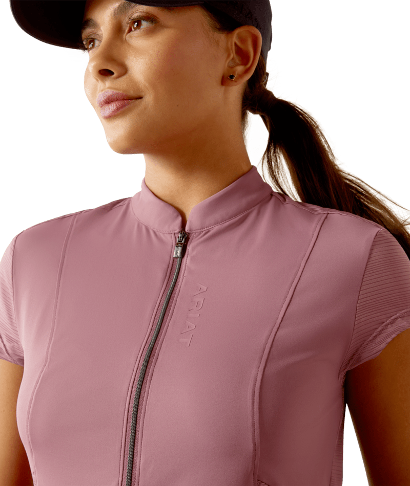 Close-up front view of a model wearing the tulipwood Ariat Breathe 1/2 Zip Short Sleeve Baselayer on a white background