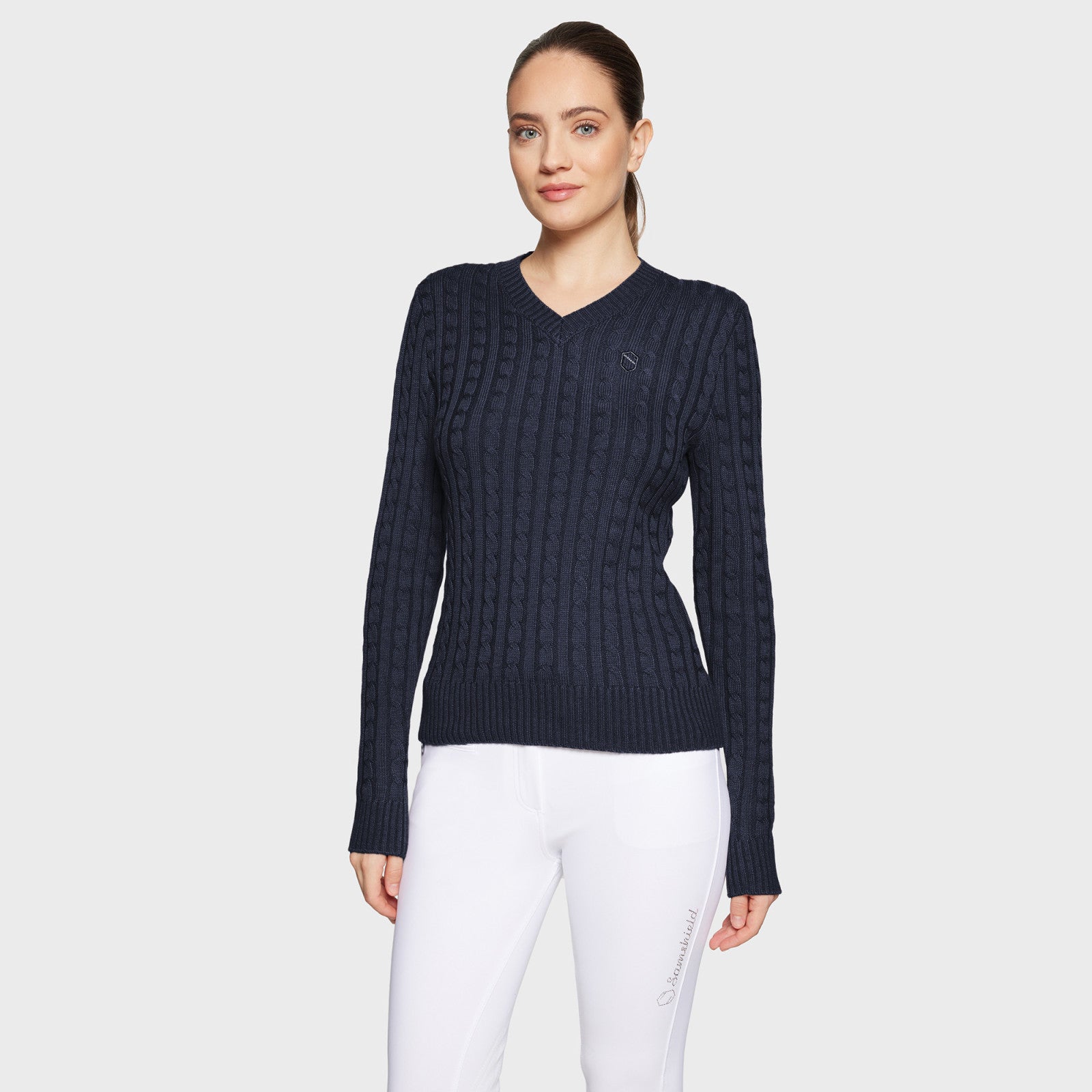 Front view of a female model wearing the Navy Samshield Lisa Twisted Sweater on a plain background