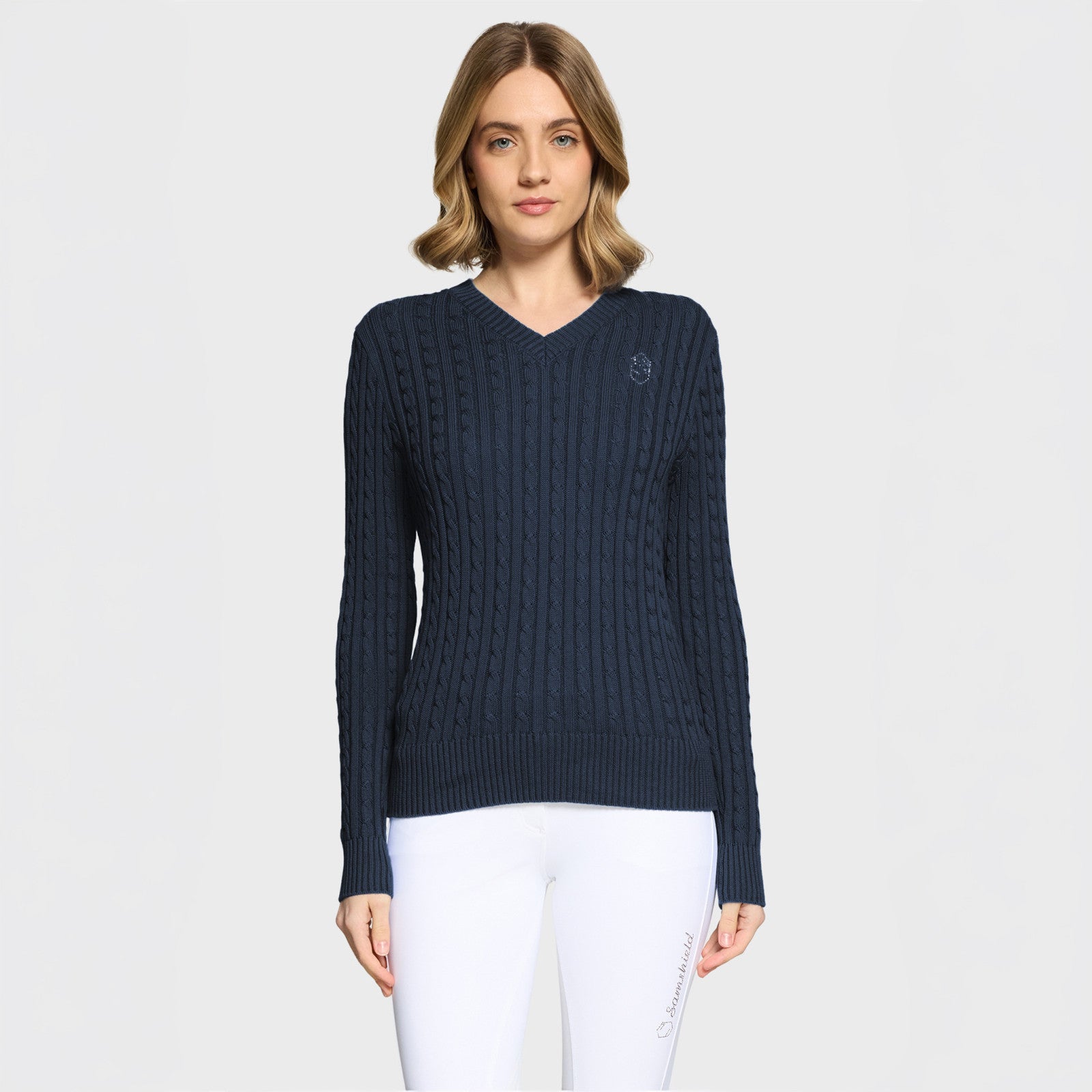 Front view of a female model wearing the Navy Samshield Lisa Twisted Sweater on a plain background