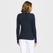 Back view of a female model wearing the Navy Samshield Lisa Twisted Sweater on a plain background