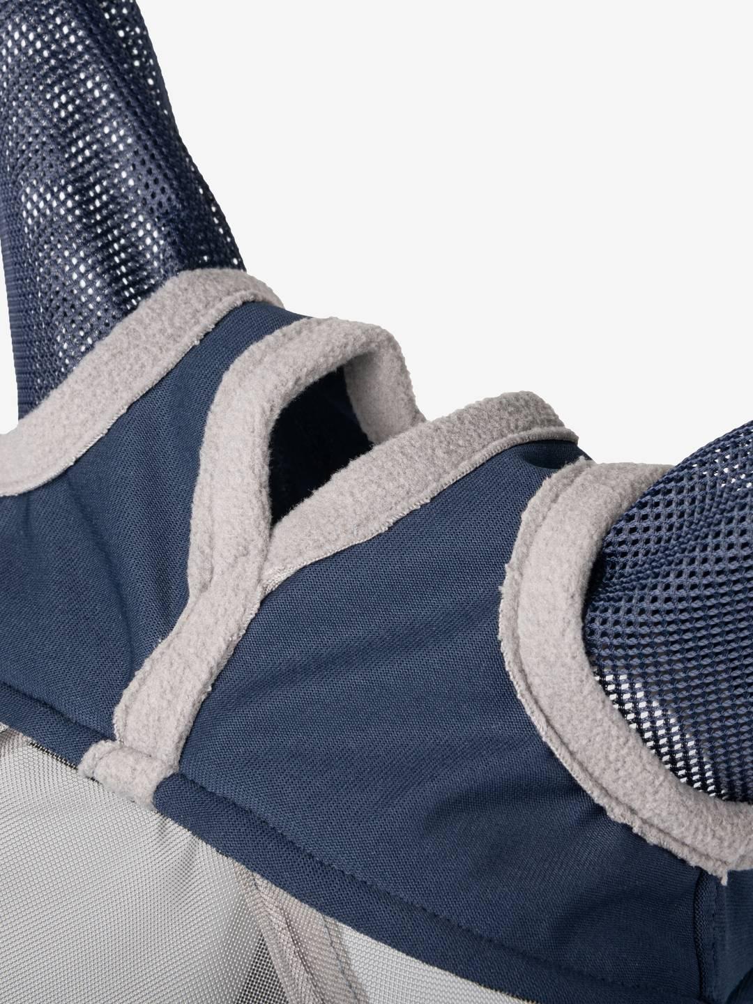 Close-up view of the forelock slit on the navy Lemieux ArmourShield Pro Half Fly Mask