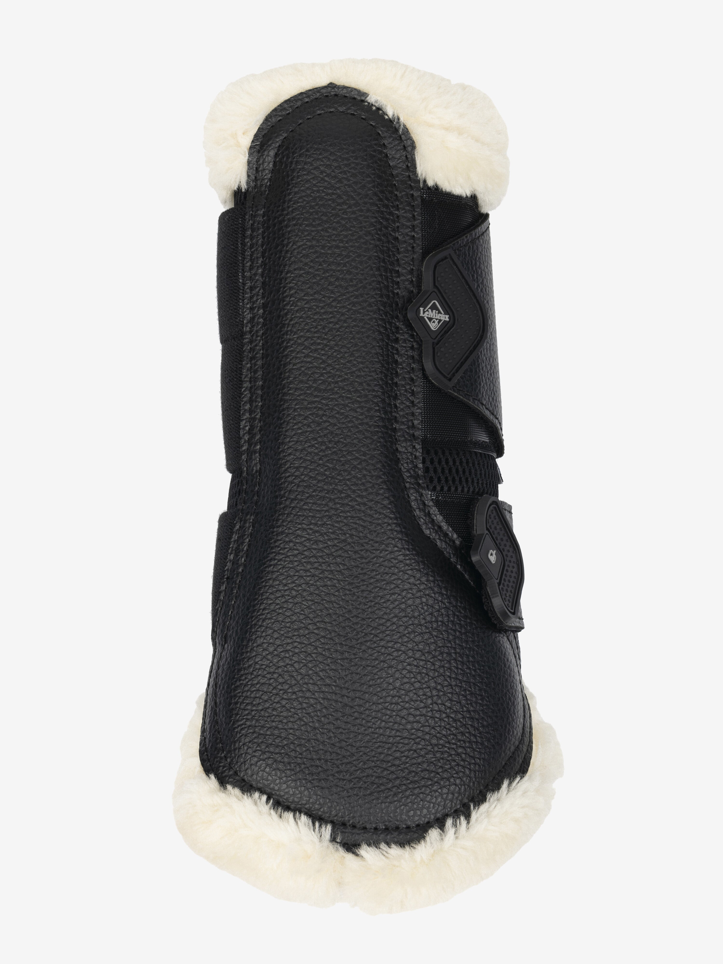 Back view of the black/natural LeMieux Fleece Edged Brushing Boot on a white background