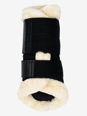 Front view of the black/natural LeMieux Fleece Edged Brushing Boot on a white background