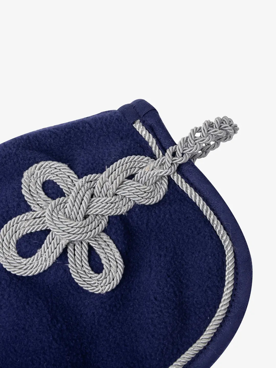 Close-up of cording detail on the deep blue LeMieux toy fleece cooler
