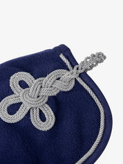Close-up of cording detail on the deep blue LeMieux toy fleece cooler