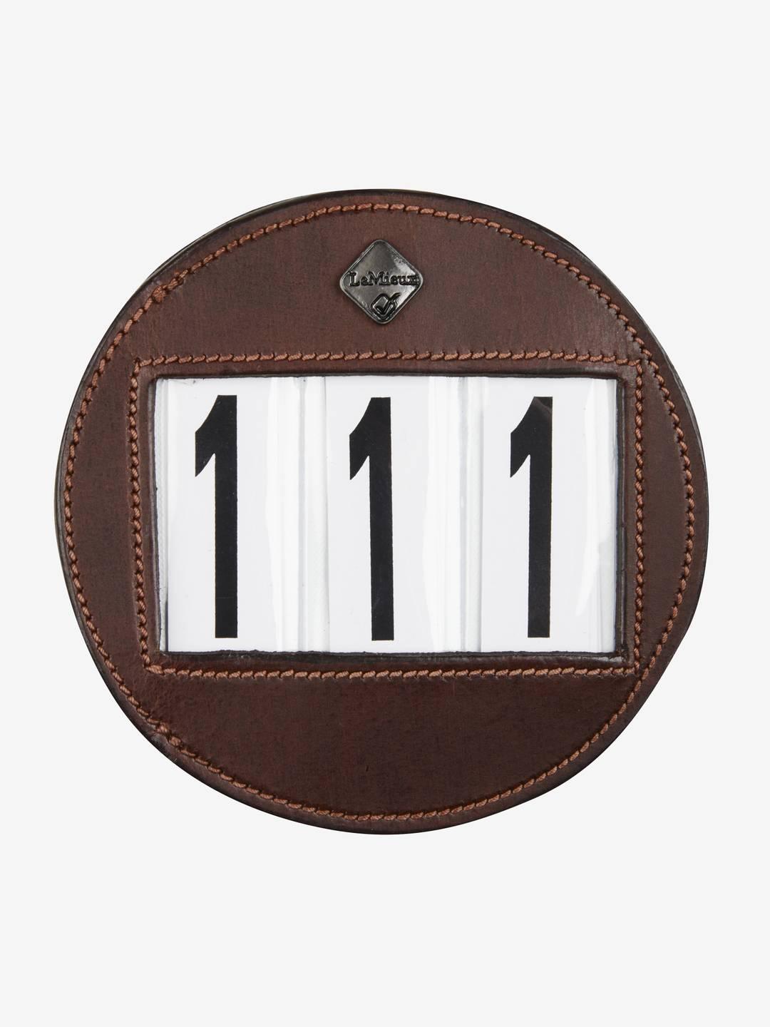 Front view of the brown LeMieux Bridle Number Holder showing 111 on a white background