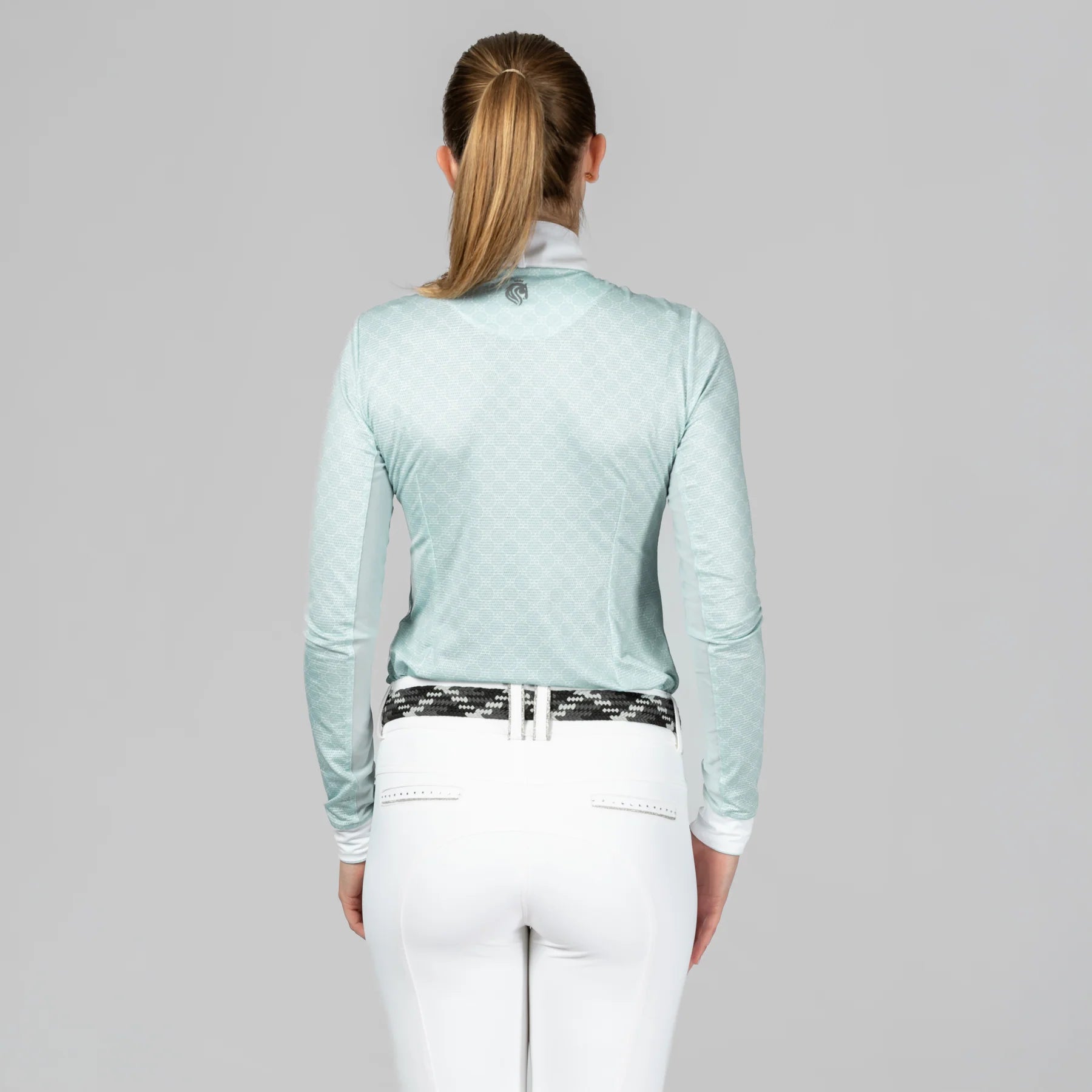 Back view of a model wearing Green Sprout Equinavia Martha Long Sleeve Show Shirt on a plain background