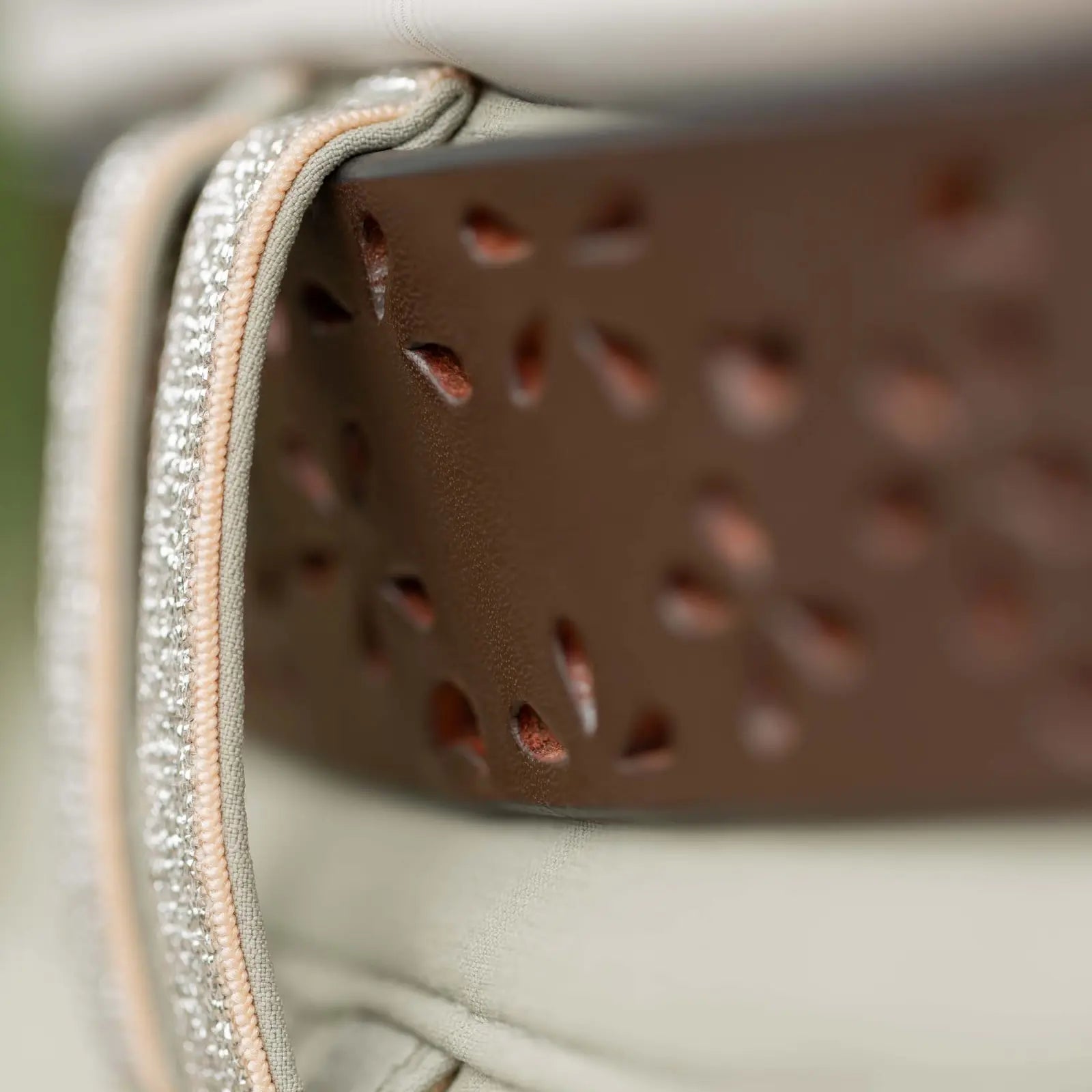 Close up view of the flower cuts in the Equinavia Emmi Flowers Leather Belt, chocolate brown