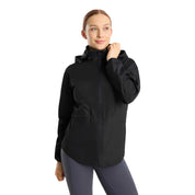 Front view of a model wearing the navy Horze Fiora Lightweight Waterproof Jacket on a white background