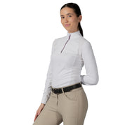 Angled front view of a female model wearing the Equinavia Sonja Long Sleeve Show Shirt on a white background