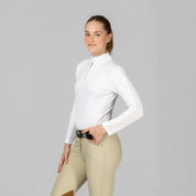 Angled front view of a model wearing White Equinavia Selma Long Sleeve Show Shirt on a plain background