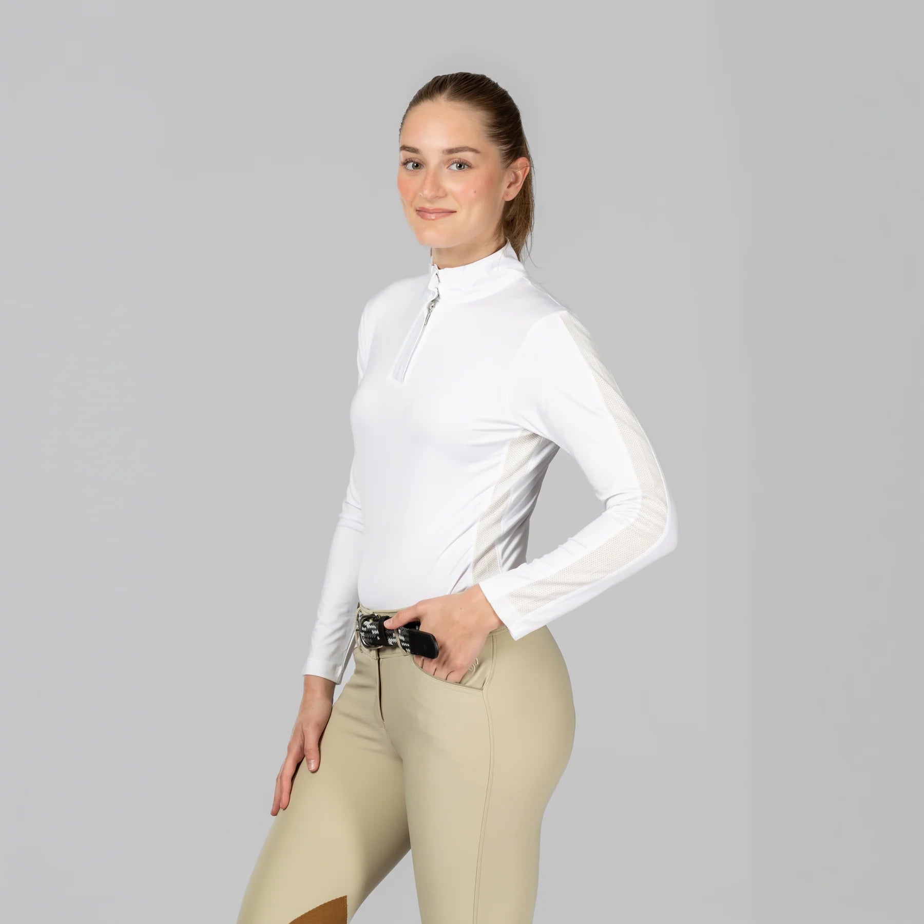 Angled front view of a model wearing White Equinavia Selma Long Sleeve Show Shirt on a plain background