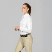 Angled side view of a model wearing White Equinavia Selma Long Sleeve Show Shirt on a plain background