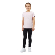 Full body front view of a young model wearing the pink Horze Wilda Kids Equestrian T-Shirt, black pants, and white shoes on a white background