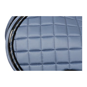 Side closeup view of Dusk Blue Equinavia Copenhagen Stay Put All Purpose Saddle Pad on a white background