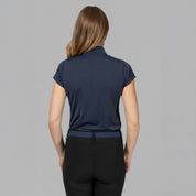 Back view of a female model wearing the B Vertigo Aubrie Cooling Training Shirt on a plain background