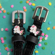 Close-up view of the Phat Unicorn Mane Jane Spur Straps on a sprinkle confetti background