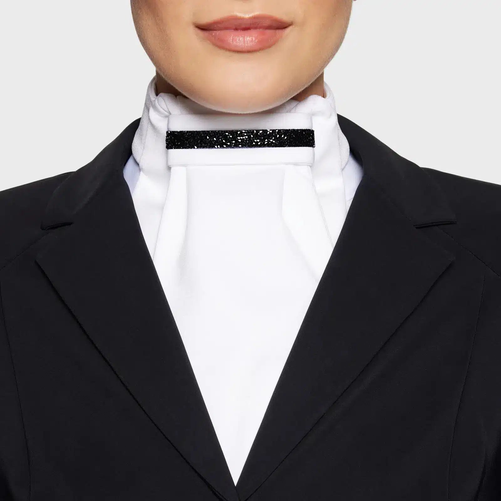 Front view of a model wearing the Black Chrome Samshield Plastron Premium Stock Tie under a black show coat