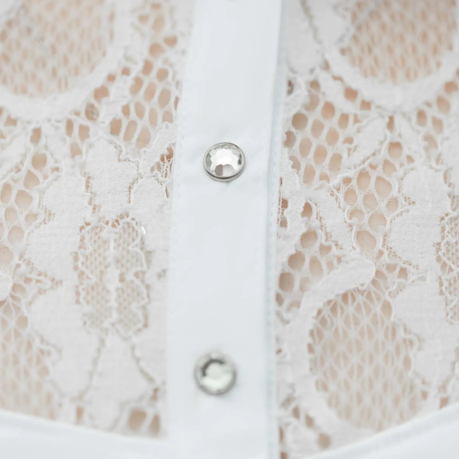 Close-up view of the rhinestone buttons on the white Equinavia Lisa Lace Long Sleeve Show Shirt