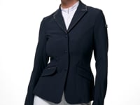 Video showing a female model posing while wearing the navy LeMieux Brilliance Diana Show Jacket on a plain background