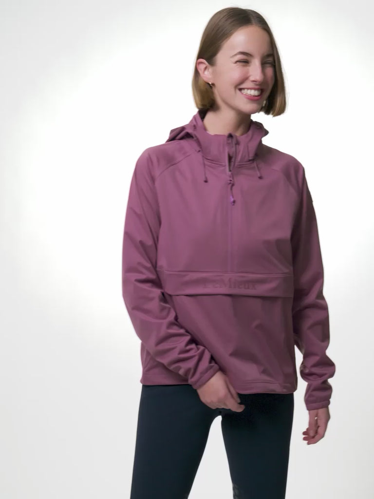 Video of model wearing LeMieux Perri Half Zip Waterproof Jacket in Mallow, posing to show details