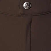 Close-up front view of the button on the brown Equinavia Anders Mens Full Seat Breeches on a white background