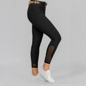 Side view of a model wearing Black Equinavia Sissel Full Seat Breeches on a plain background